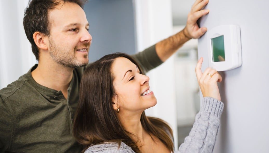 women-win-the-battle-of-the-thermostat-dial